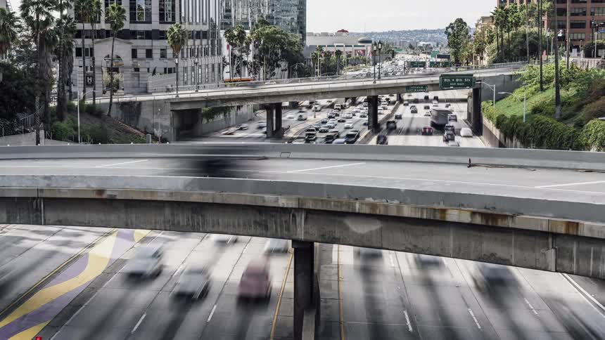 Cars drive on a city highway