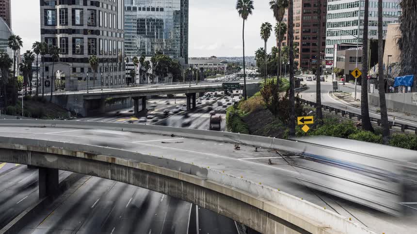 The busy intersection is full of cars in the city