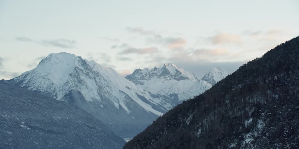 Tall rocky mountains with snowy tops
