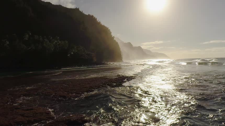 The sun shines down on a beach