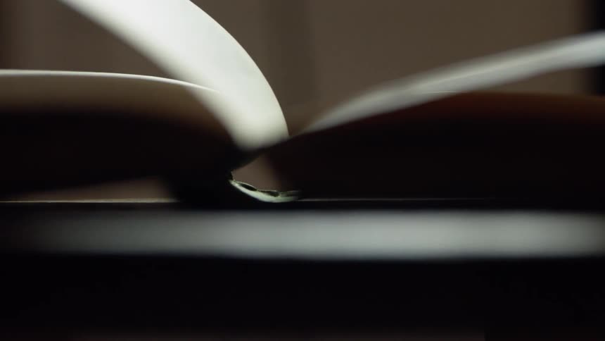 Opened book lying on a table
