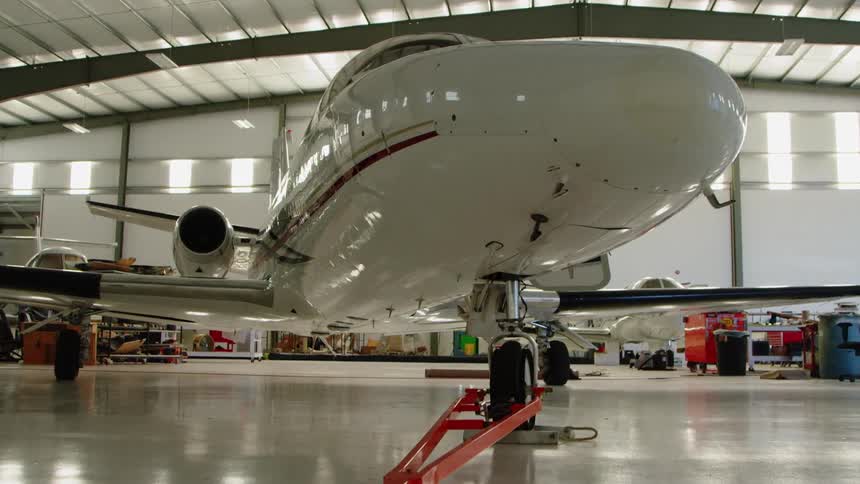 Airplane is parked in a hangar