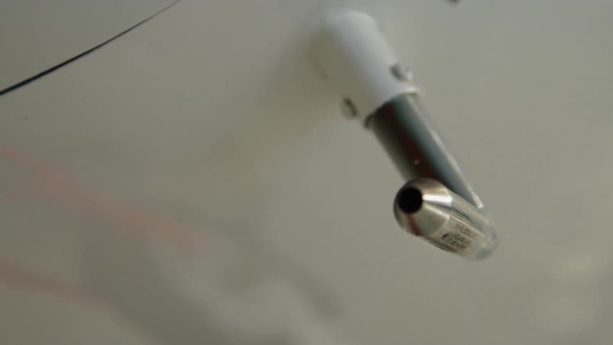 Metal piece sticking out of the side of a white panel