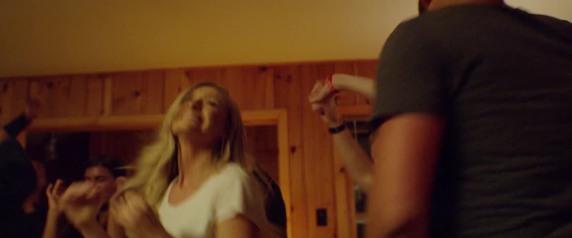 People dance at a house party
