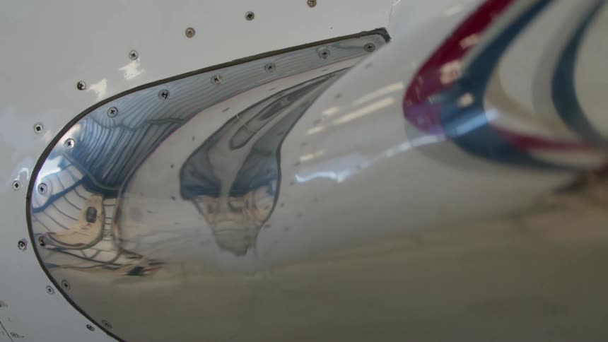 The airplane is reflecting light on the side