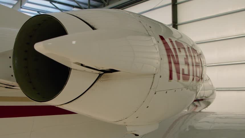 An airplane is parked in a hangar