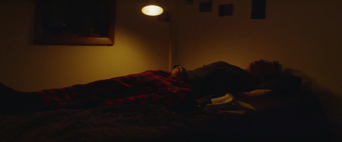 The person jumps out of bed in the dark