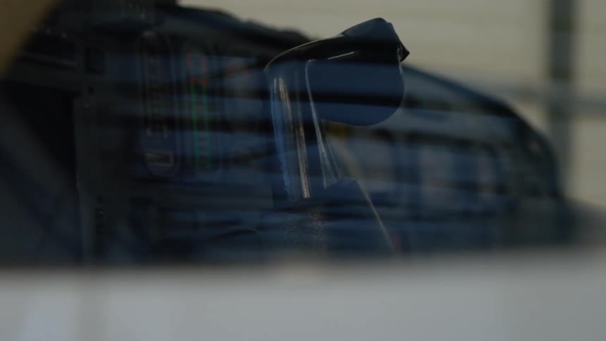 The rearview mirror is reflecting metal