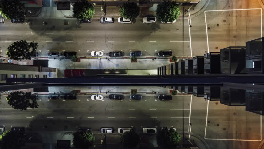The cars light up the rode below as they travel