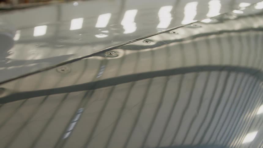 Rivets cover the side of an airplane
