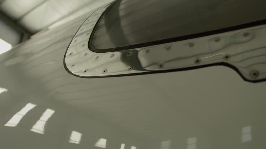 Side of a plane in a hangar