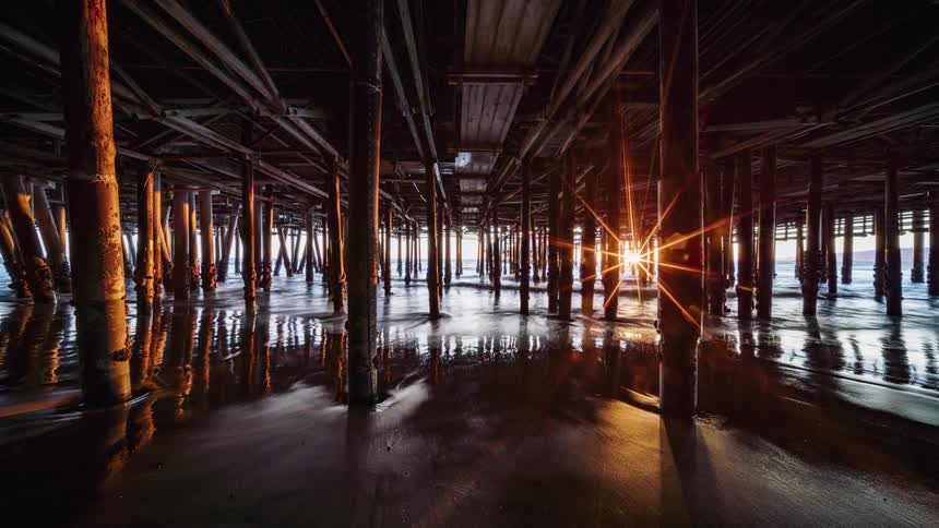 The water splashes underneath the boardwalk