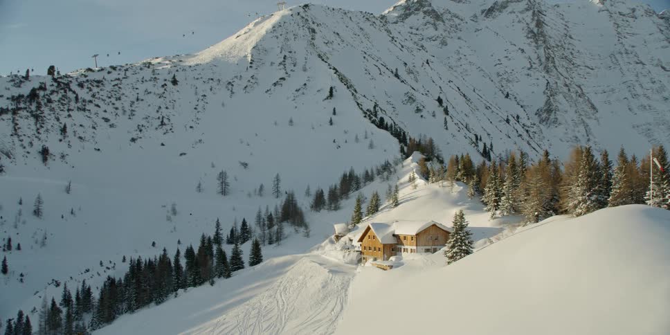 A single house sits on this mountain range