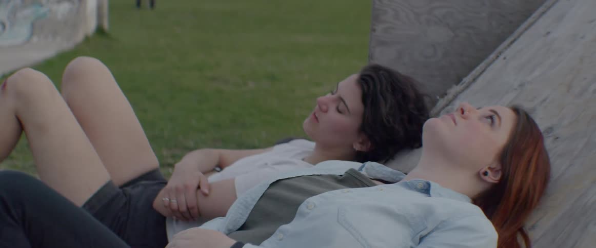 The women rest on the lawn