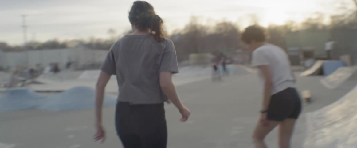 Teenagers have fun in the skate park