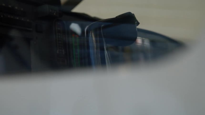 A control panel is shown in a cockpit