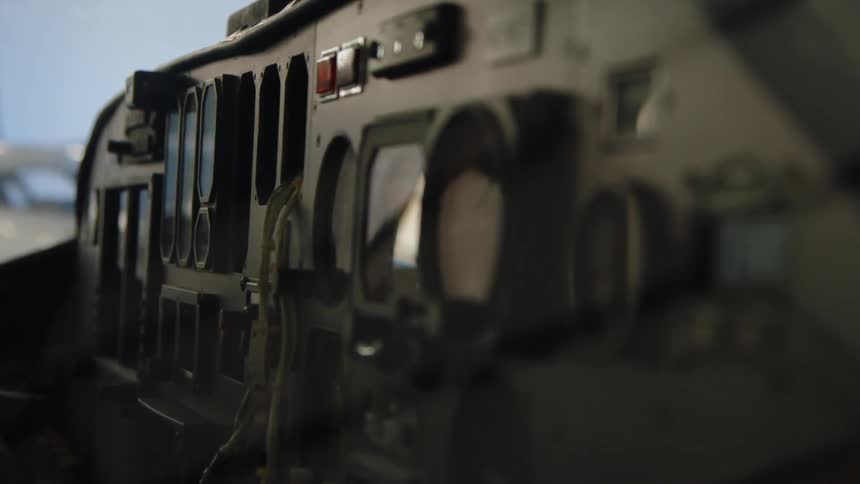 The cockpit has many dials and levers
