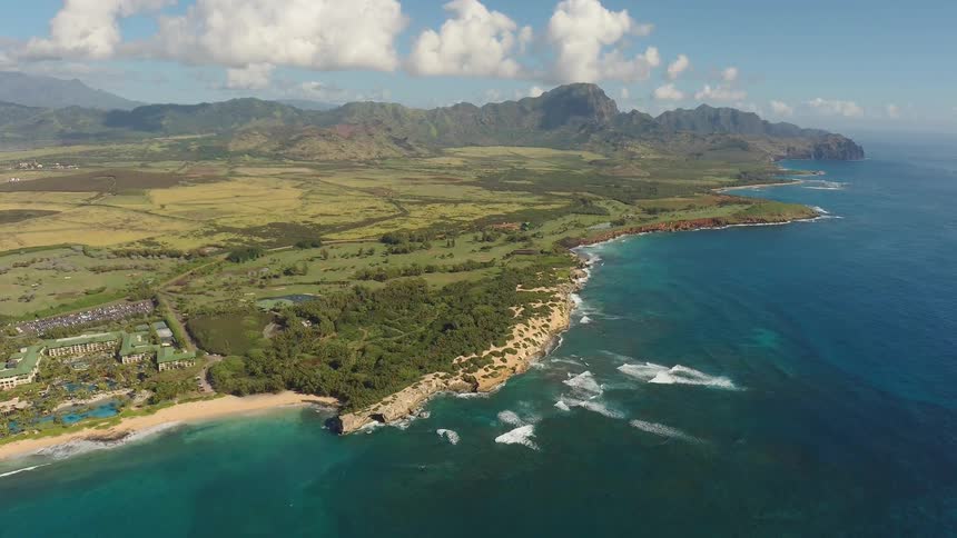 The tide flows onto the beach shore