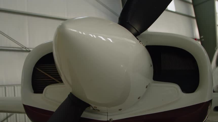 A plane is stopped in the hangar