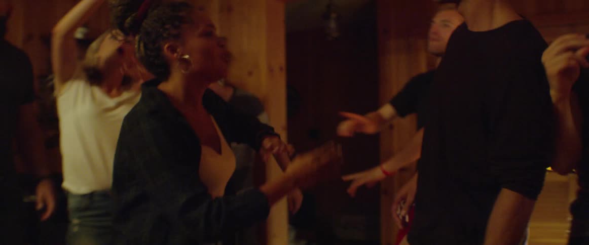 The people are dancing together at a party