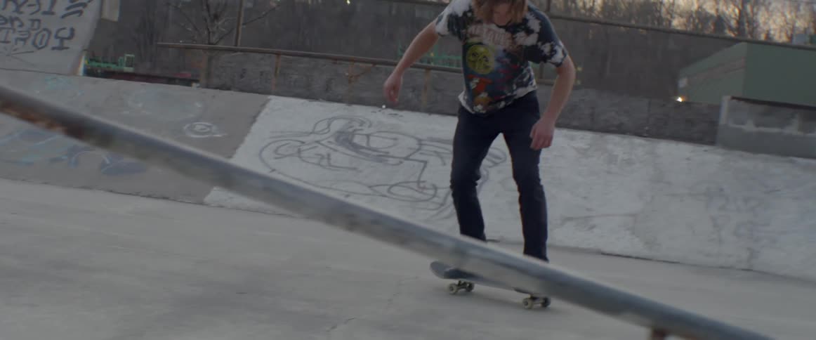 Man does a stunt on his skateboard