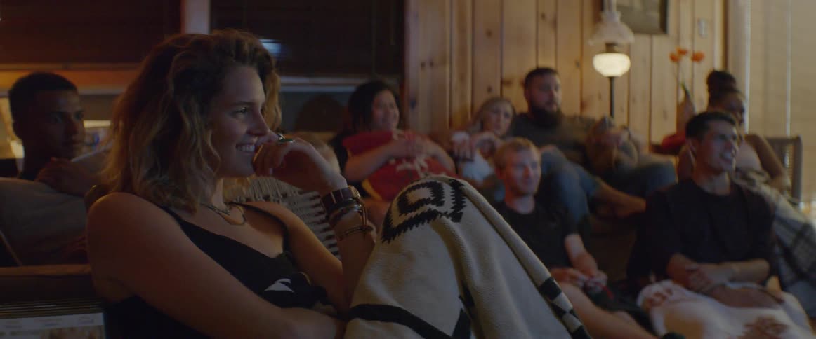 The people are having fun watching a movie