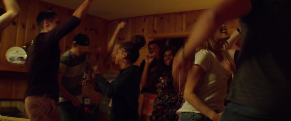 People dance at a house party