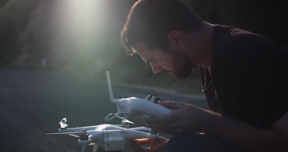 Man preparing to fly a drone