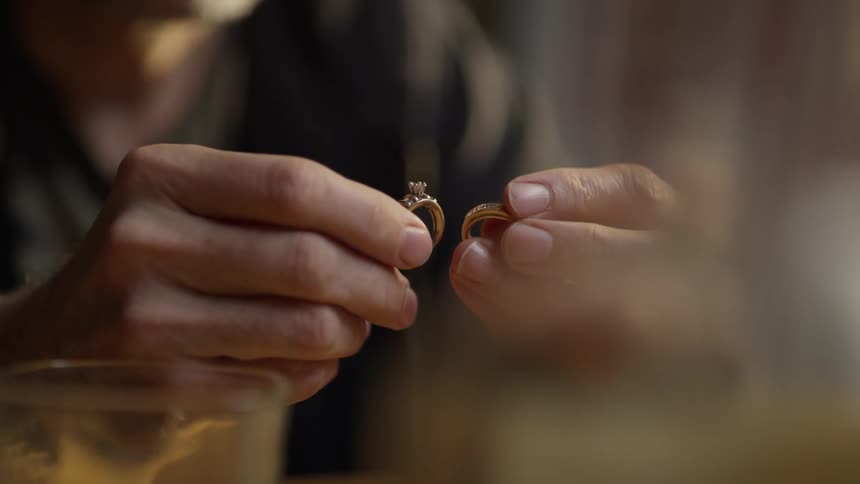 Person holding a ring in each hand