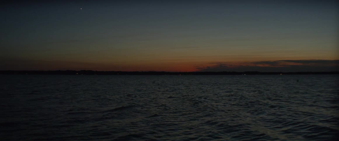 Gentle waters of the sea at a dark sunset