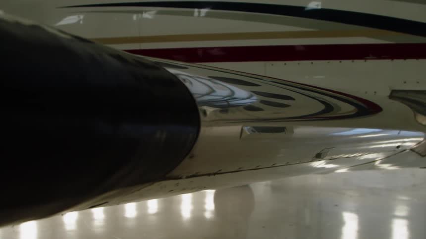 An airplane sits in a hangar