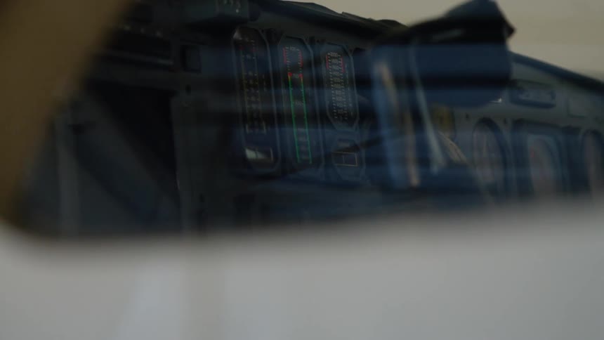 The mirror is giving off a reflection in the vehicle
