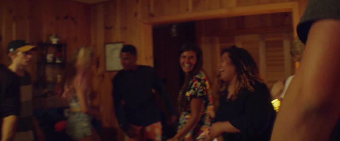 A group of people dance happily