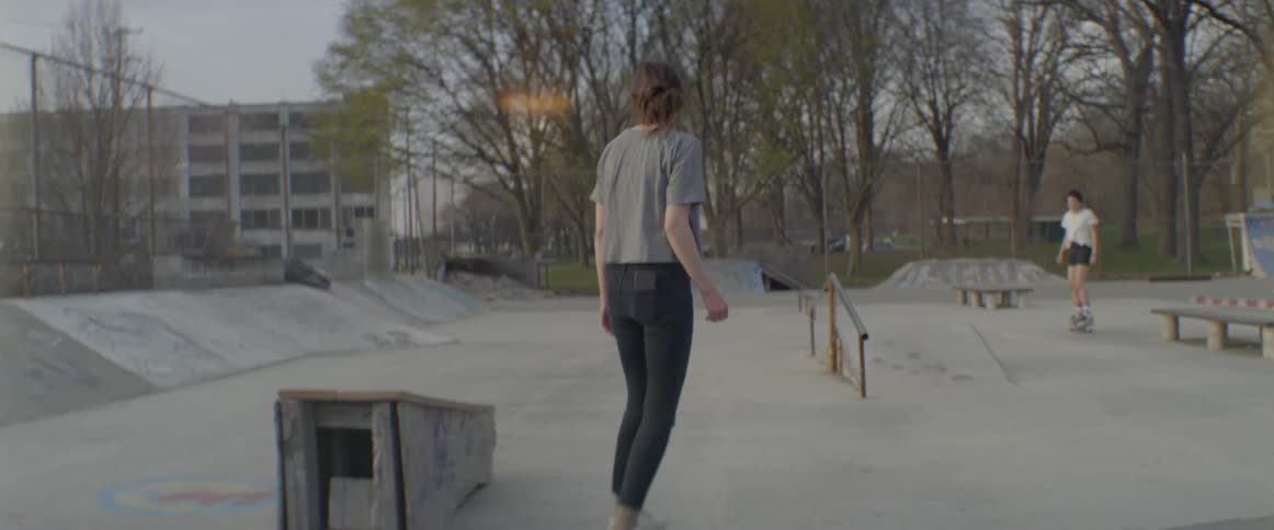 Woman skateboards in a park