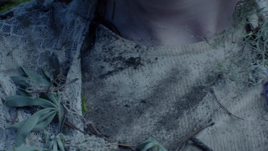 Person covered in moss and dirt
