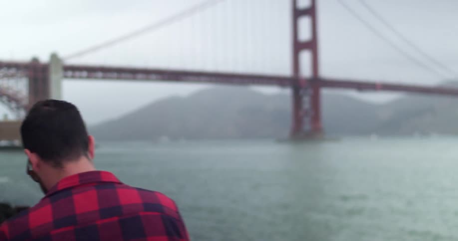 Man taking a photo of the Golden Gate Bridge
