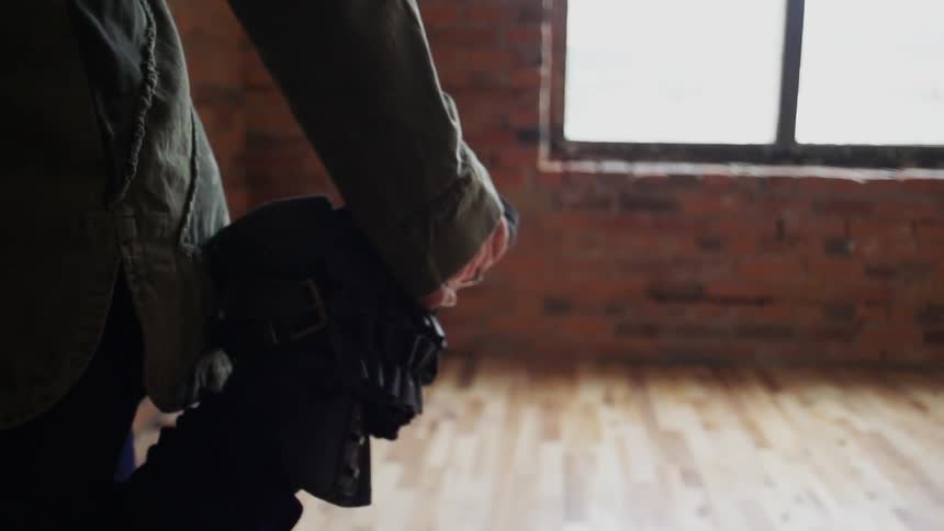 Close up of a person standing still in an empty room