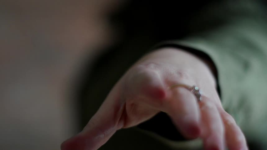 A woman's hand reaching out