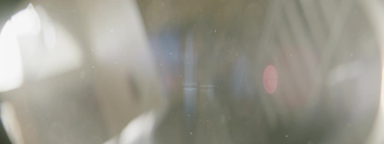 Sunlight and dust dance in the interior of a room during the day
