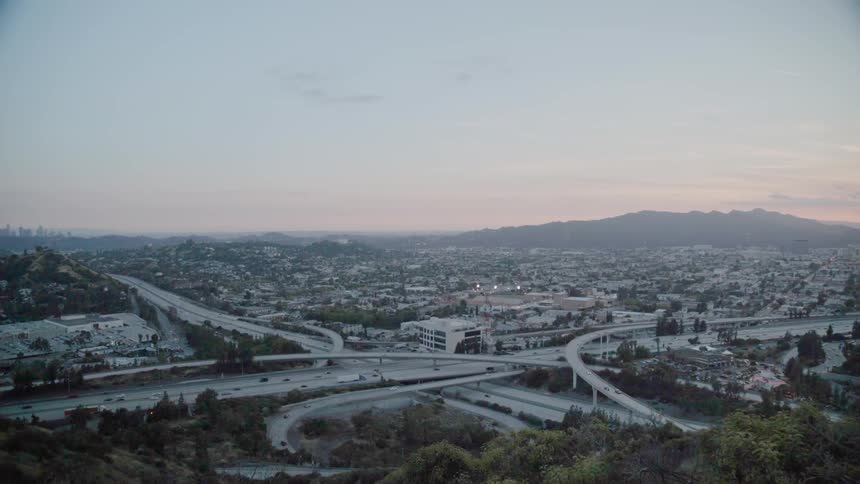 Cars drive on a city highway