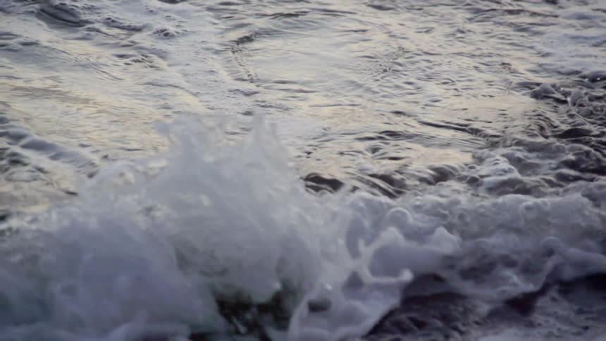 Ocean waves crashing during the day