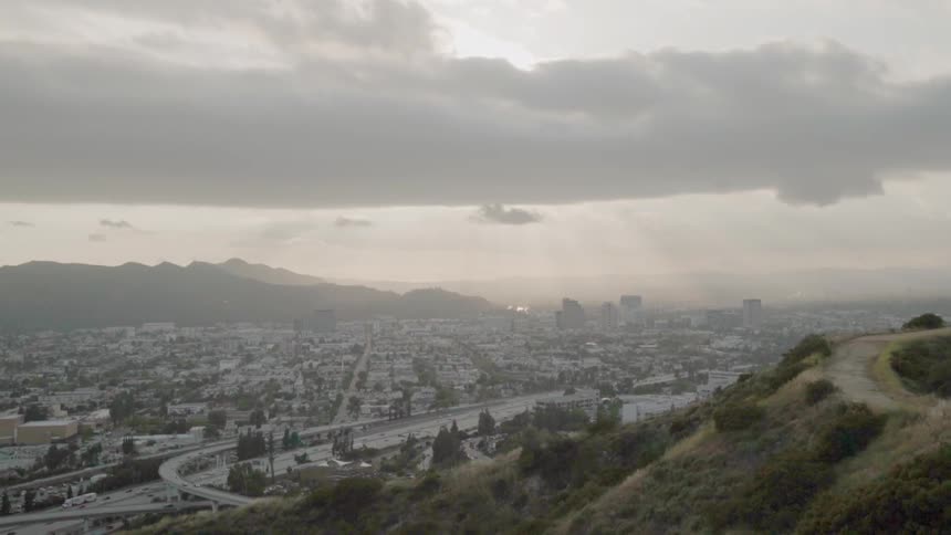 City in a valley on a cloudy day