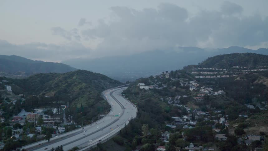 Vehicles travel on a highway