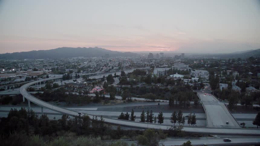 A curving highway leads into town below