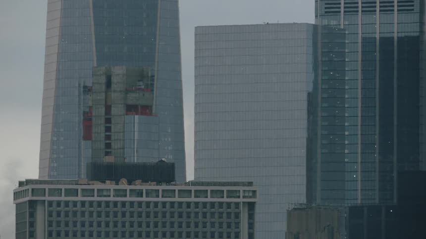 The birds fly off the tall buildings