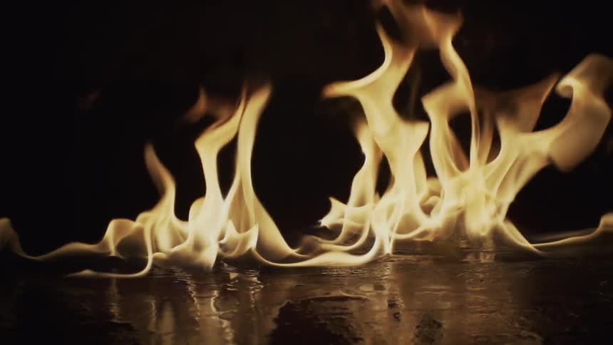 Flames lick across the surface