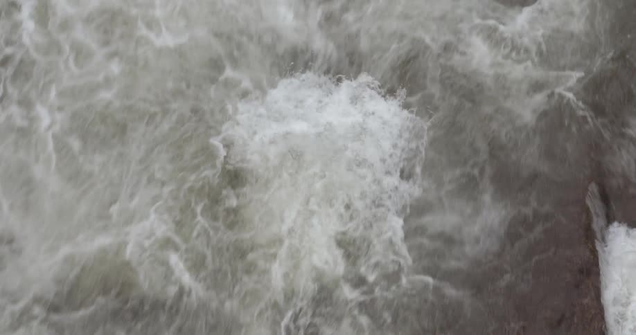 Frothy waves splash in the water