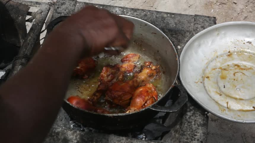 Chicken is cooked in a pan