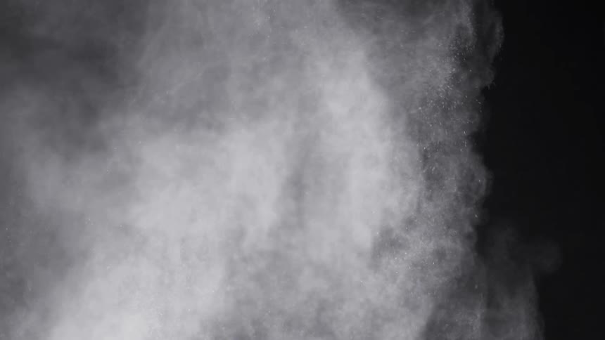 Smoking billowing against black backdrop