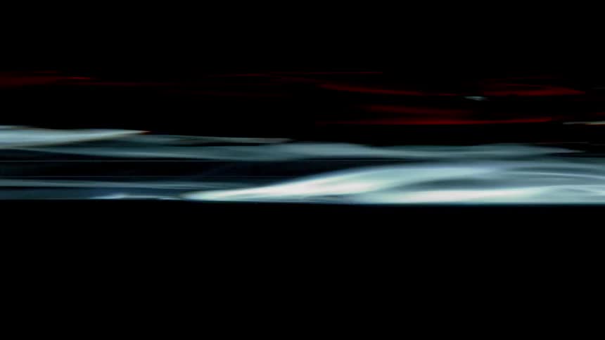 Multicolored lights streak in the dark